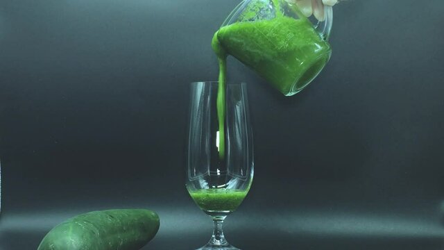 Green mint garnishing straw and glass with herval juice vegan healthy drink in mexico city