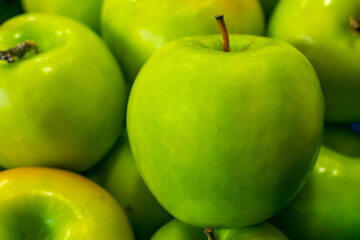 Close up green apples on a market