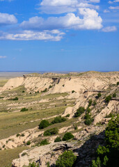 Fototapeta na wymiar Pawnee Buttes in Pawnee National Grasslands, Great Plains of northeastern Colorado with late afternoon clouds forming against the blue sky