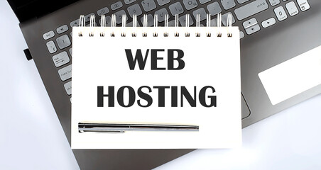 Business concept - Top view notebook writing Web Hosting on the laptop