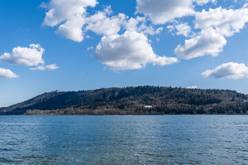 View to Indian Arm from North Vancouver Canada sunny spring day white clouds on blue sky