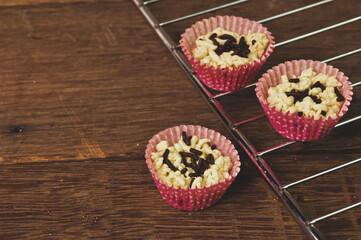 Malaysian traditional homemade cookies called as KUIH SARAG SEMUT with chocolate rise served during Eid Fitri.