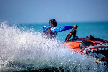 A man driving a jet ski