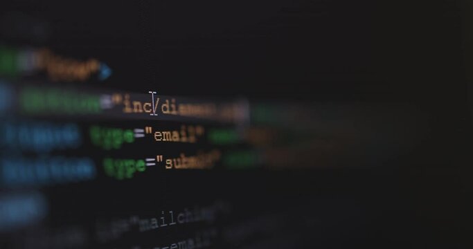 4K Close up shot HTML tag code on PC Monitor scroll down. Background concept for programming and coding web development.