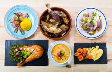 Various dishes of national Norwegian cuisine served with vegetables, herbs and seasoning