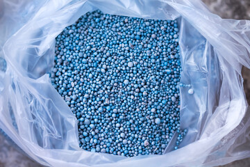 Fertilizer chemical for plants or tree in plastic bag top view