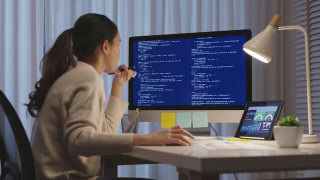 Back view young asia female people analyst coder code language multiple screen cloud online computing ai deep tech work at home office late night reskill upskill, future agile cyber ux web design job.