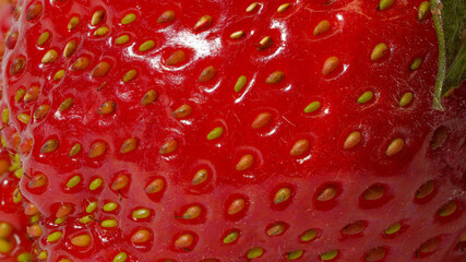 Macro photo of the surface of overripe strawberries