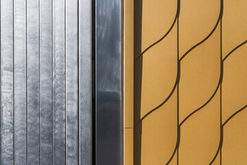 Golden and silver metallic shining wall pattern, architectural design concept, closeup, repeating lines and shapes