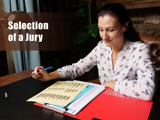  Selection of a Jury sign. Closeup portrait of unrecognizable successful Businesswoman wearing formal suit reading documents