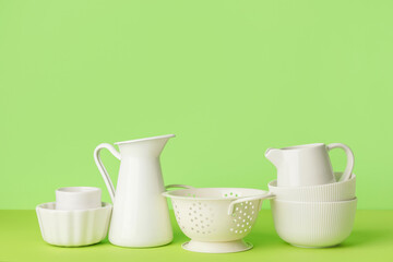 Set of kitchen utensils on color background
