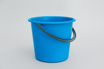 Plastic bucket on light background