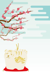 トラの置物と梅の花と雲が背景にある年賀状イラスト