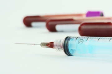 Vacuum tubes for collection and blood samples on white background..Transparent with purple and...