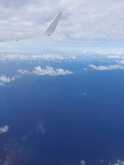 view of jet wing and blue sky