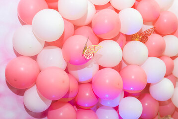 Fototapeta na wymiar Modern space design - happy birthday - on pink background with balloons. Concept of layout of congratulatory space, holidays. Selective focus