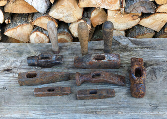 scrap metal from various spare parts, rusty old antique iron hammers, scrap metal