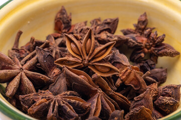 Star anise in a vintage ceramic bowl