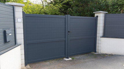 modern gray high dark gate aluminum portal outdoor door front of suburb house