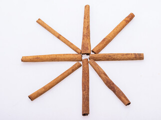 Cinnamon sticks, classic spice from the inner bark of tropical Asian trees, flavorful and aromatic for cooking, baking, health food and medicinal uses.