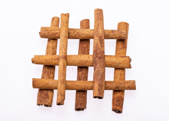 Cinnamon sticks, classic spice from the inner bark of tropical Asian trees, flavorful and aromatic for cooking, baking, health food and medicinal uses.