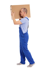 side view of handsome man loader in uniform walking with big box on his shoulder isolated on white