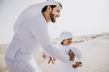 father and son spending time in the desert