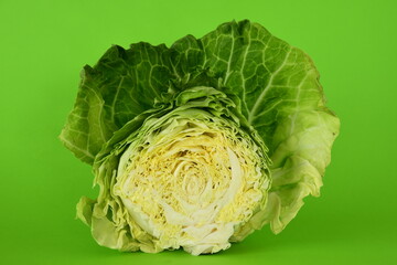 Green cabbage isolated on green background