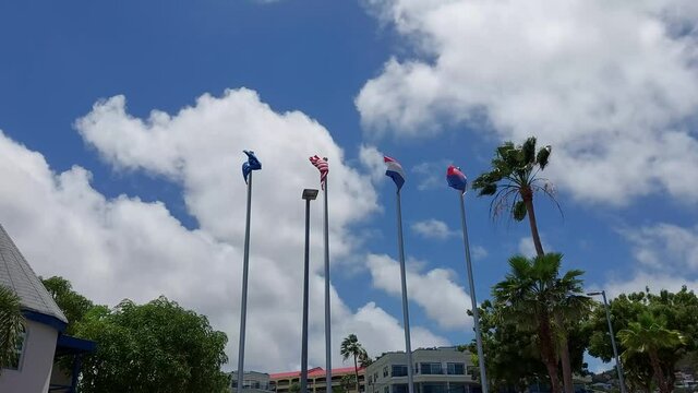 Netherlands USA And St. Maarten Flag Waving In Wind And Blue Sky In St. Marten