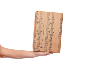 A Beautiful gift in the hands of a girl on a white background