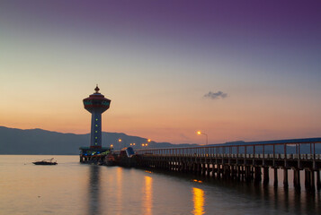 Beautiful scenery sunset landscape,Silhouette Scene of Custom Pier and Lighthouse in Ranong, Thailand