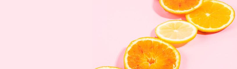 Colorful orange citrus slice fruit texture background on pastel pink