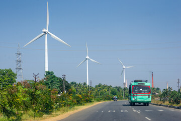 Generic Rural Bus on the road and wind turbines