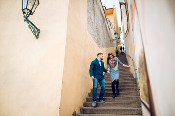Obraz na płótnie Canvas Loving young couple walking around Prague, Czech Republic