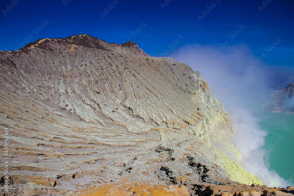 Wall mural volcano mountain texture, layer of rock at kawah ijen. the sheer sulfur walls of the mount ijen crat