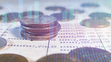 Growing money saving and investment concept; double exposure of coins stack on bank account book with growing trend candle stick graph.