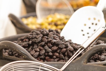 Dehydrated black olives in street stall, food concept