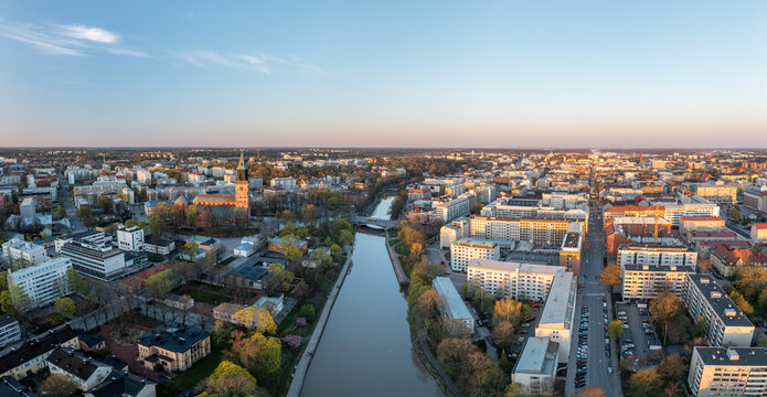 Aerial panorama of Turku city center, Cathedral of Turku and Aura river in spring in Finland.