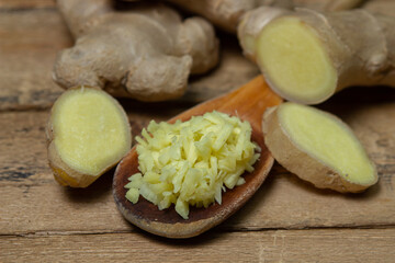 Ginger on a wooden background. Chopped ginger root. Healthy food. Healthy food concept