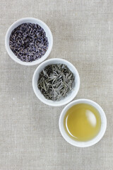 Lavender dry herb in a bowl with flowers nearby, closeup, from above overhead top view, natural medicine, naturopathy, organic cosmetics, sleep tea, skin and hair care concept