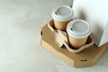 Delivery containers for takeaway food on white textured table