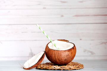 background with split coconuts close-up. coconuts and copy space. coconuts lay flat.