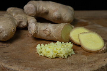 Ginger on a wooden background. Chopped ginger root. Healthy food. Healthy food concept