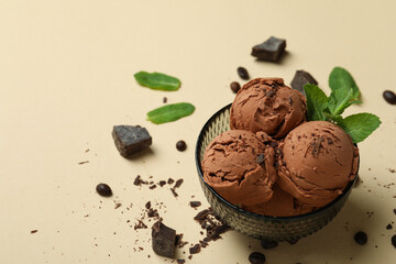 Delicious chocolate ice cream on beige background