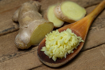 Ginger on a wooden background. Chopped ginger root. Healthy food. Healthy food concept