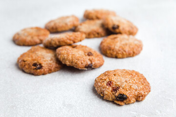 Few sweet oatmeal cookies on a light background