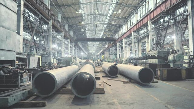 Pipe factory production line warehouse interior, metalwork heavy industry.
