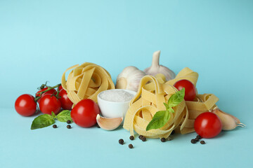 Concept of cooking tasty pasta on blue background