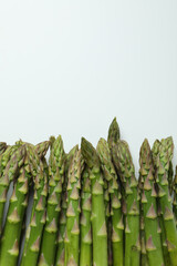 Fresh green asparagus on white background, space for text