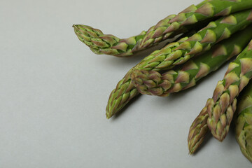 Asparagus on light gray background, close up